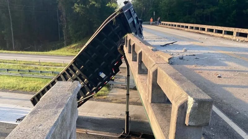 Dump Truck Hits Bridge