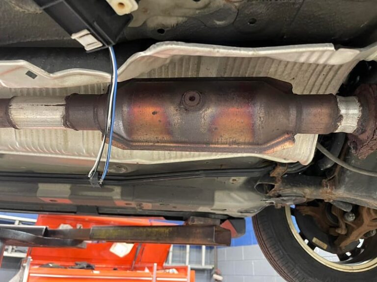 Where is the Catalytic Converter located on a Chevy Cavalier? Dump Truck